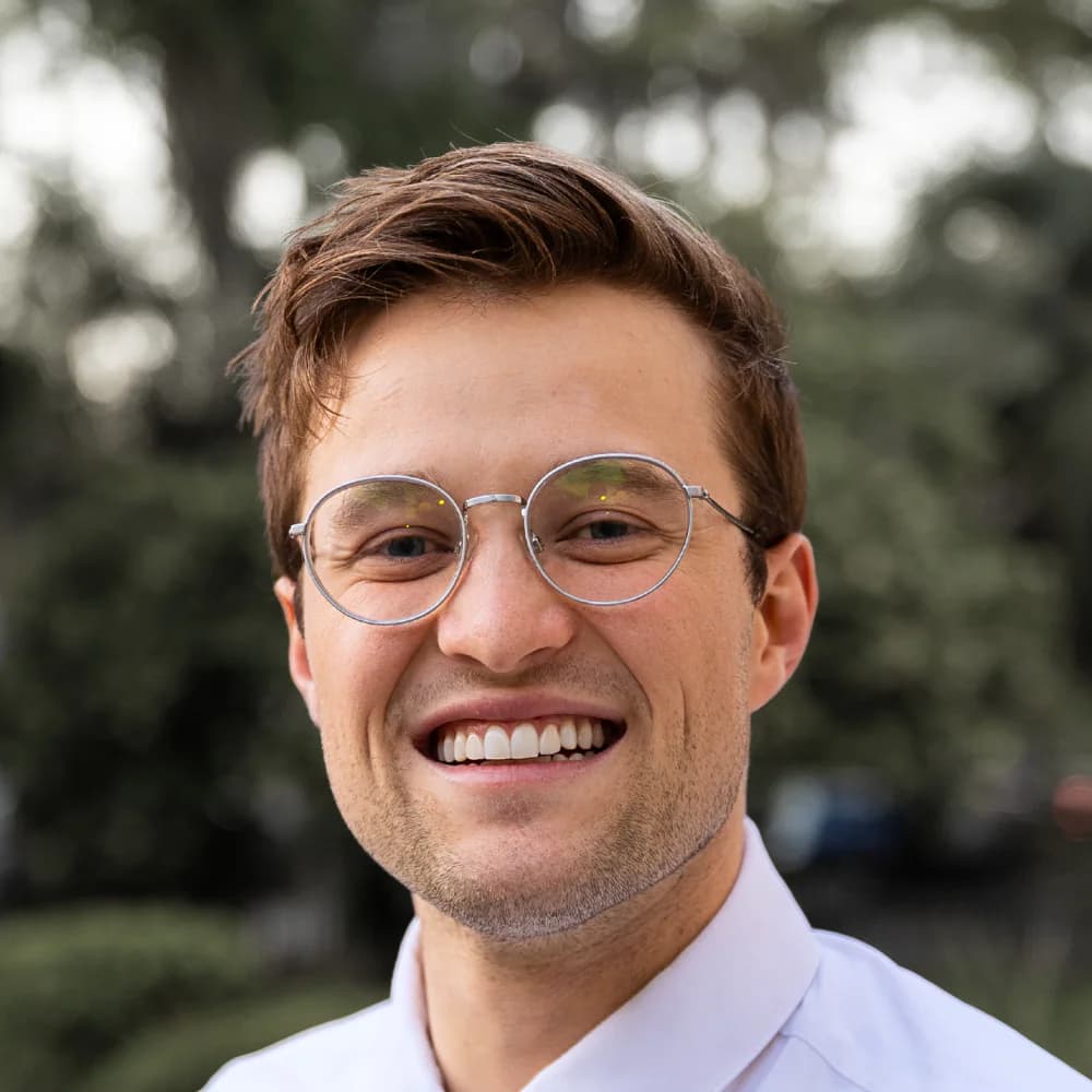 Nathan Covey smiling outdoors