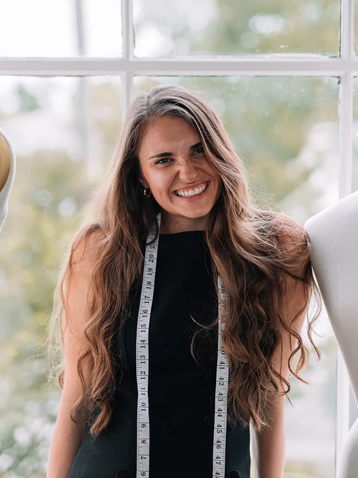 Samantha Covey smiling by a sunlit window